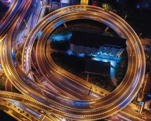 A nighttime view of a highway from above